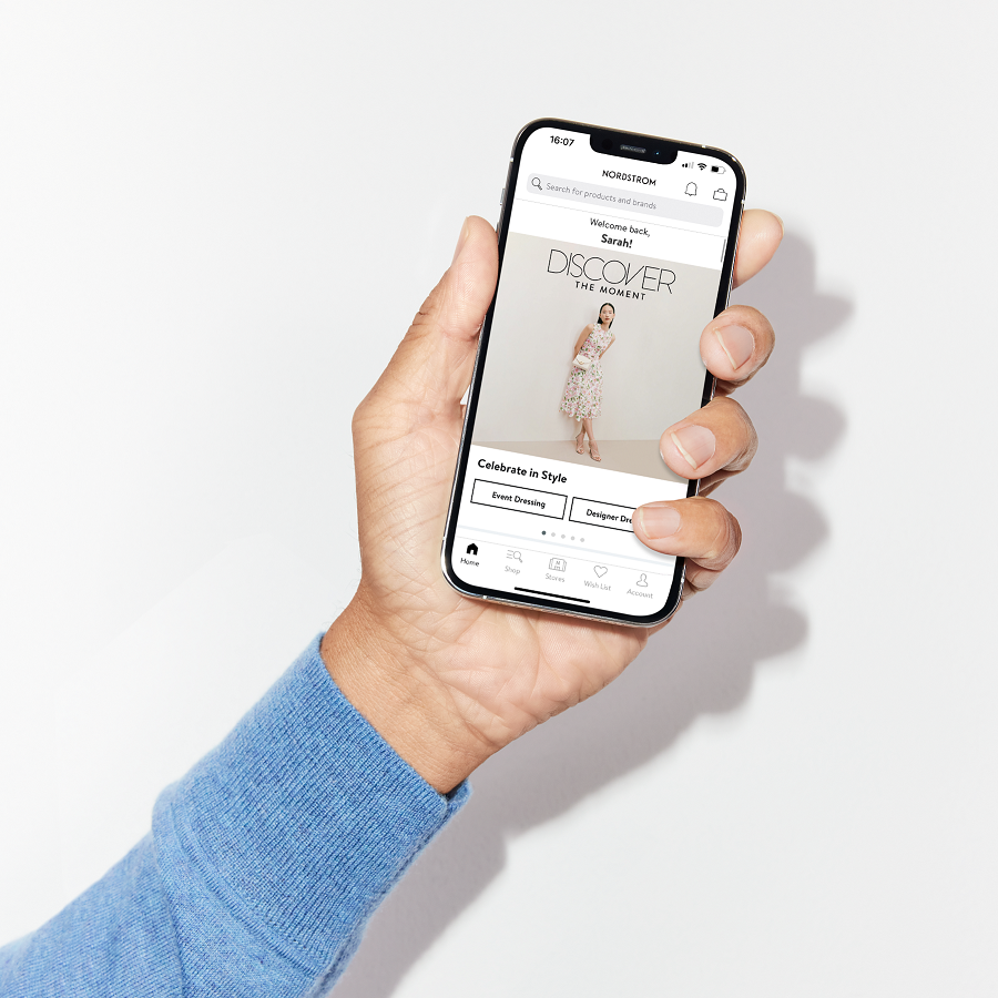 Hand holding iPhone with Nordstrom application open